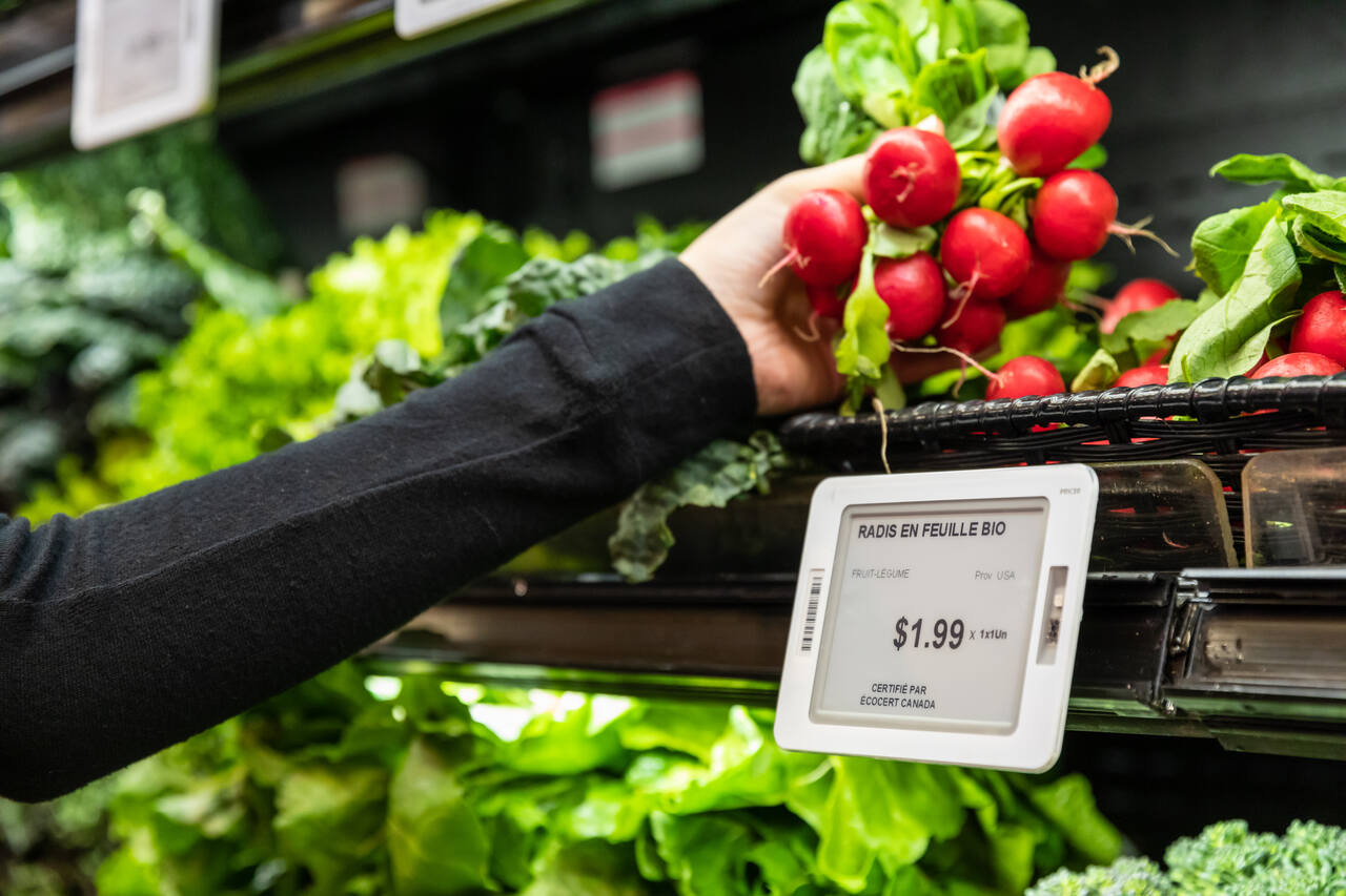 Digital price tag on grocery produce shelf